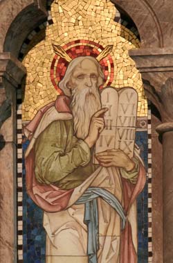 Moses holding the ten Commandments.