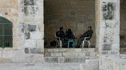 Still showing seated soldiers.