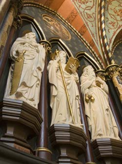 Sculptured statues of three apostles.